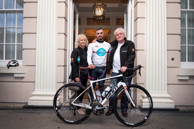 Charity fundraiser Josh Llewellyn-Jones with his parents Dawn and Adrian Llewellyn-Jones after arriving at St James’s Palace to be presented with a letter of support from the Prince of Wales