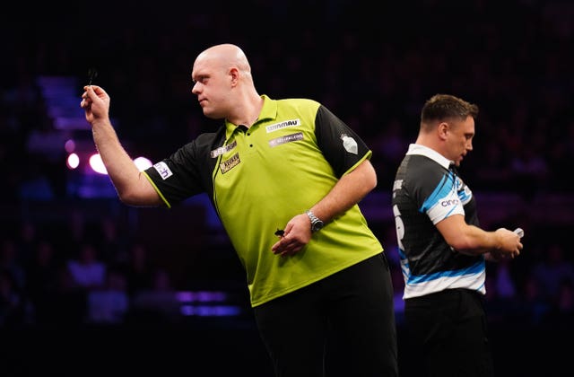 Michael van Gerwen (left) in action against Gerwyn Price in their quarter-final match during night five of the 2025 Premier League in Brighton