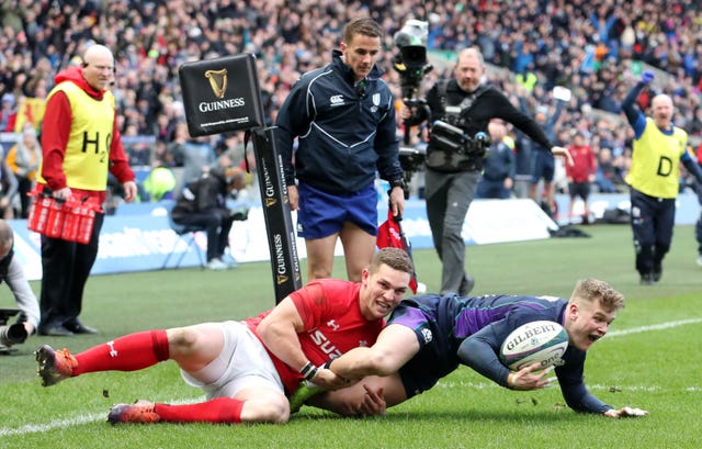 Scotland’s Darcy Graham dives in to score but there was no late drama as Wales held on for victory