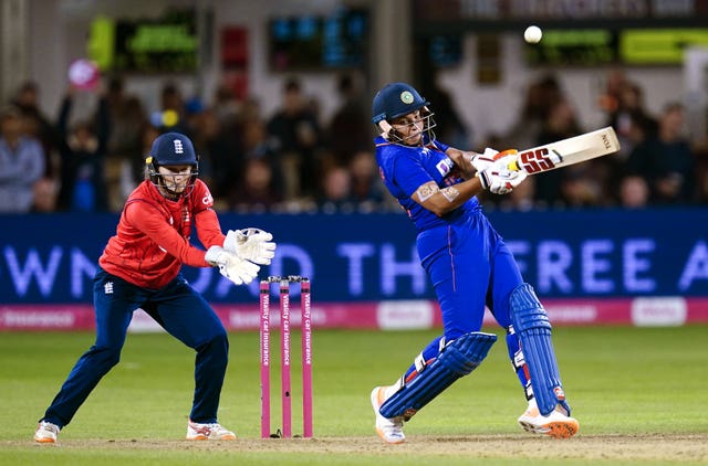 India’s Richa Ghosh and England’s Amy Jones in T20 action