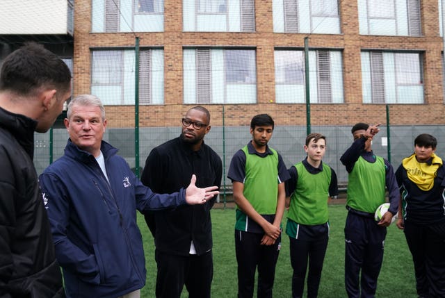 Sports Minister Stuart Andrew (second left) joined former England rugby union star Ugo Monye (right) at an event at London's Haberdasher's Borough Academy Sports Centre.