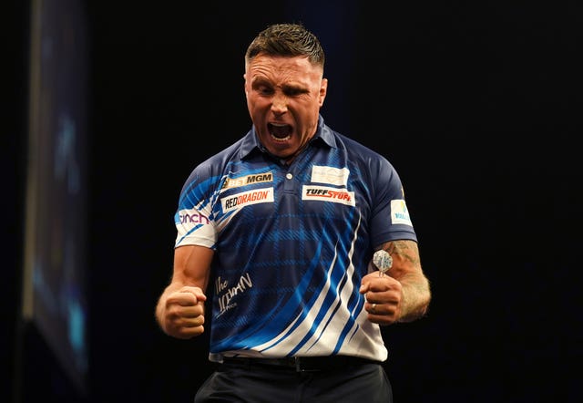 Gerwyn Price celebrates during a Premier League match