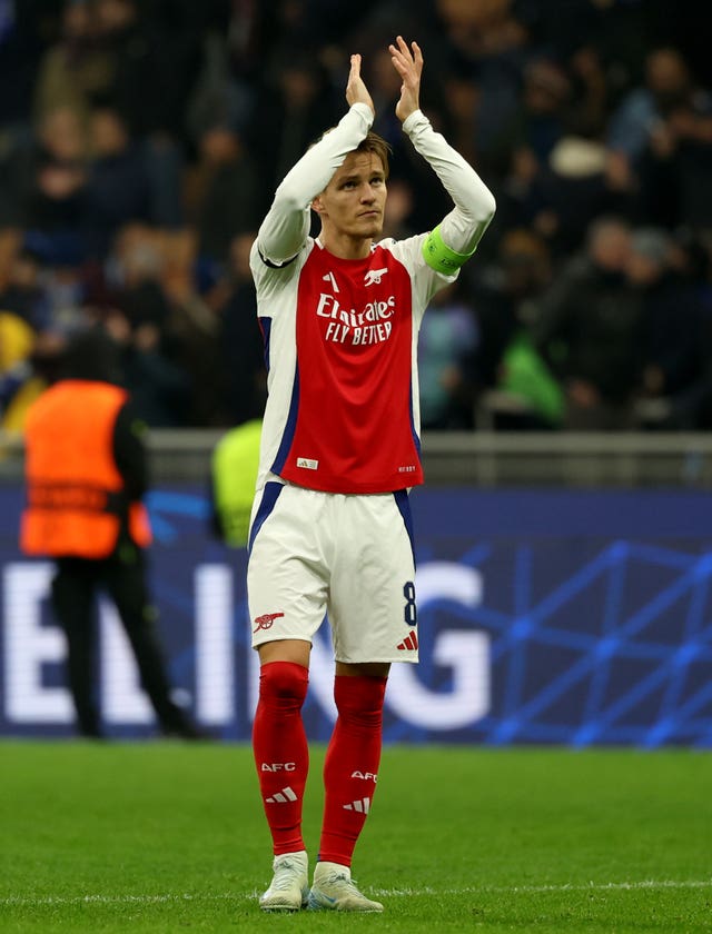 Martin Odegaard claps the Arsenal fans