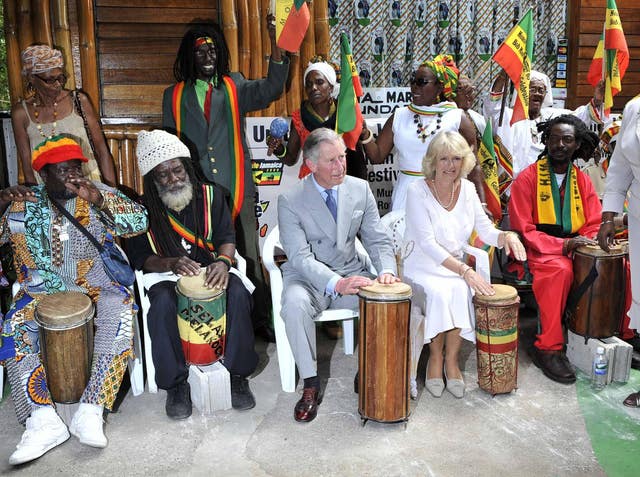 Charles and Camilla play with a band at the late reggae singer Bob Marley's home in Kingston, Jamaica, in 2008