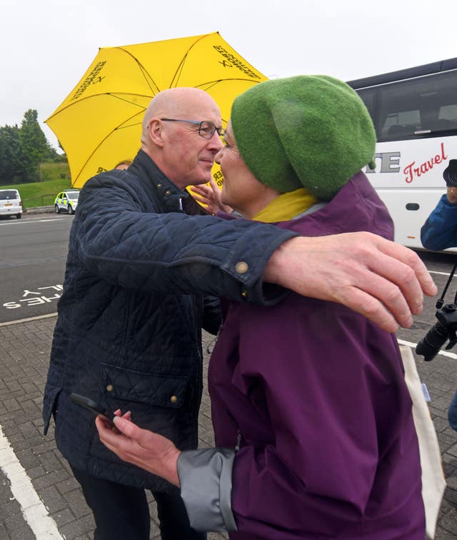 John Swinney hugging an SNP supporter
