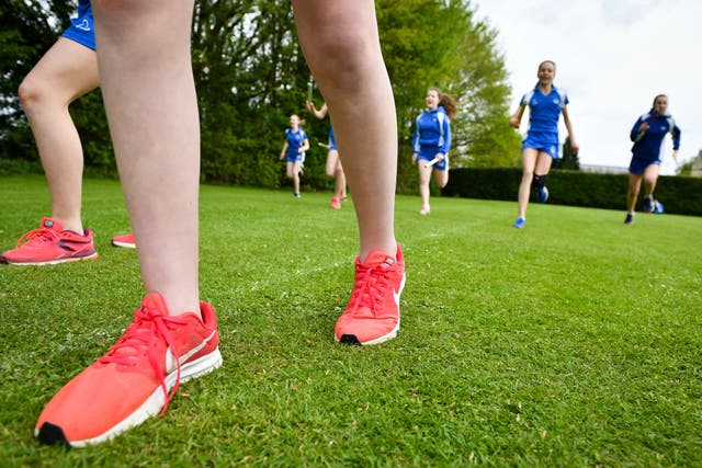 Children should step away from screens and get moving (Ben Birchall/PA)