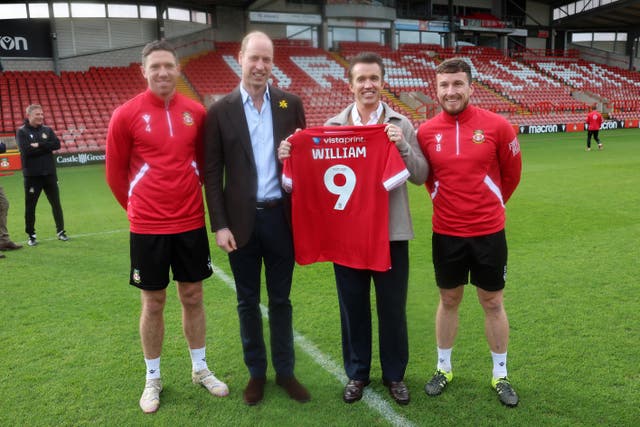 William with his personalised Wrexham AFC shirt, meeting club chairman Ben Tozer, Rob McElhenney and captain Luke Young 