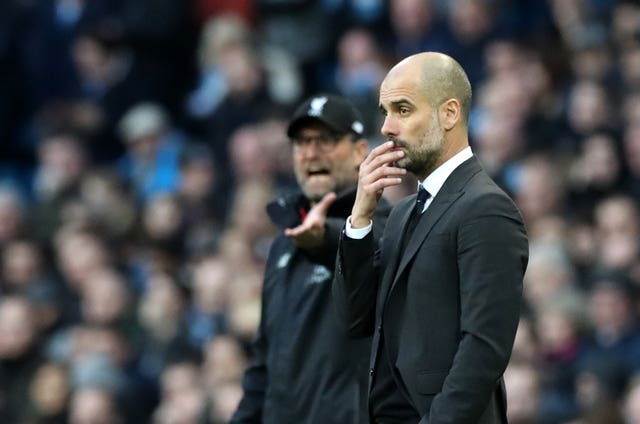 Guardiola (right) faces a strong challenge from Jurgen Klopp (left) and Liverpool