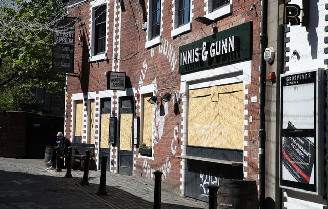 Boarded up restaurants and pubs in Glasgow (Andrew Milligan/PA)
