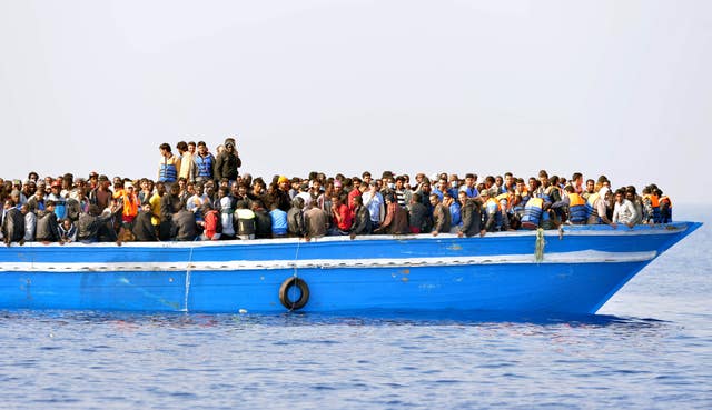 Migrants stranded on a boat, 30 miles off the Libyan coast as they are rescued by Royal Marines (Rowan Griffiths/Daily Mirror/PA)