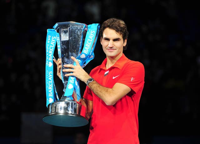 Roger Federer with the ATP Finals trophy