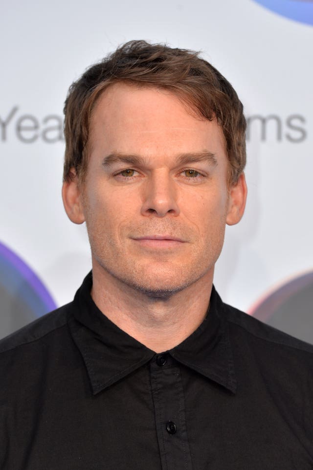 Head and shoulders photo of Michael C Hall smiling