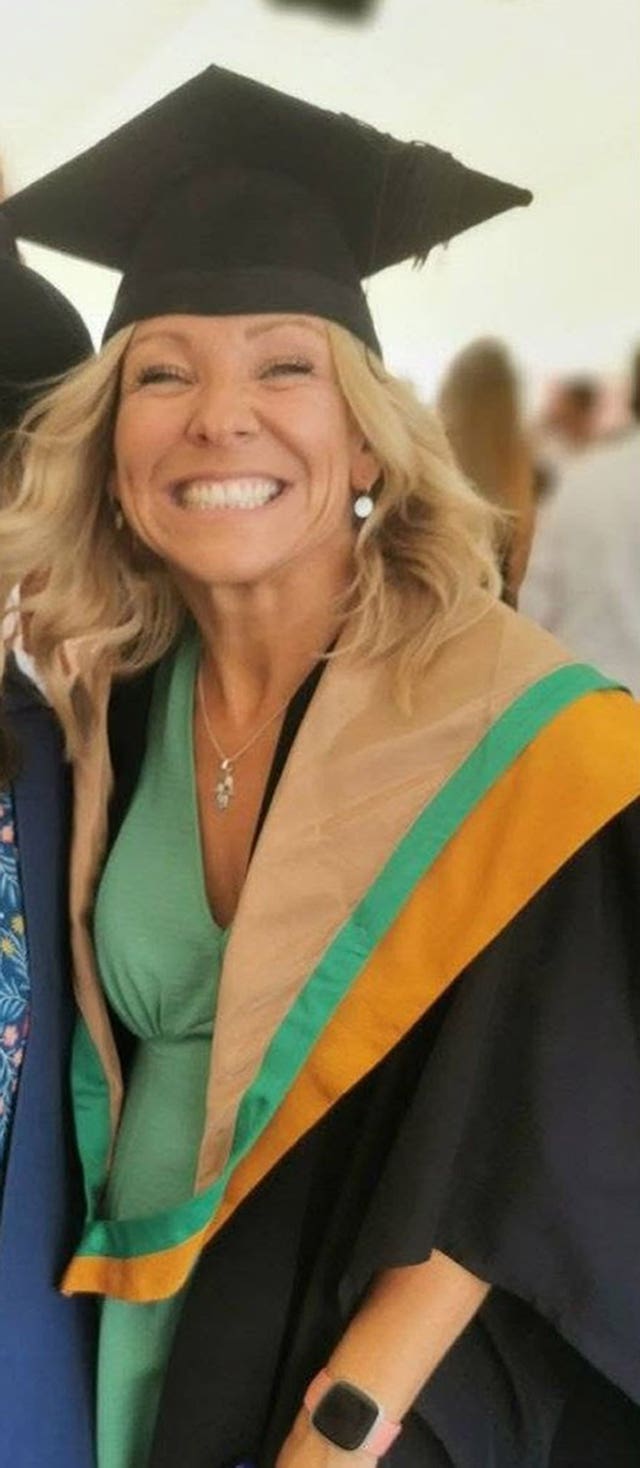 Handout photo of Claire Chick smiling, wearing graduation gown and hat