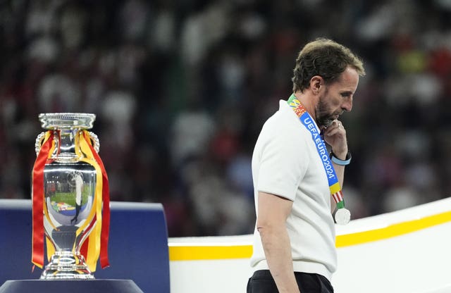 England manager Gareth Southgate walks past the Henri Delaunay Cup