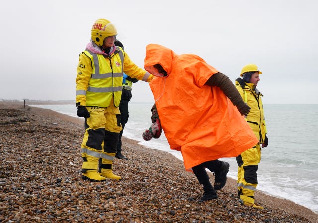 People thought to be migrants are brought in to Dungeness, Kent, after being rescued by the RNLI following a small boat incident in the Channel 