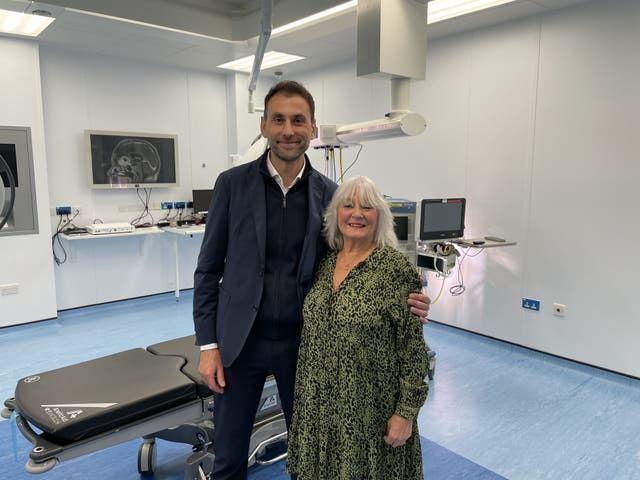 Anastasios Giamouriadis with Doreen Adams in an operating room