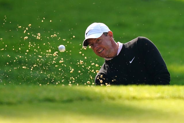 Rory McIlroy splashes out of a bunker