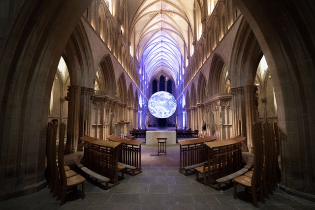 Gaia, Luke Jerram’s seven-metre-wide replica of the earth, created using detailed NASA imagery of the Earth’s surface, pictured suspended in Wells Cathedral, Somerset (James Manning/PA)