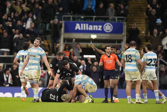Argentina players react at the final whistle