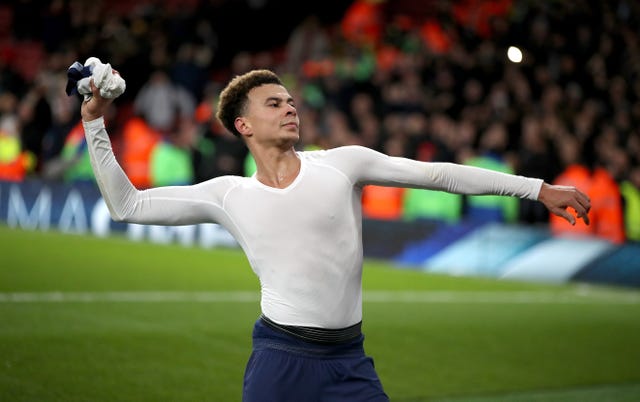 Alli throws his shirt into the crowd at the end of the game