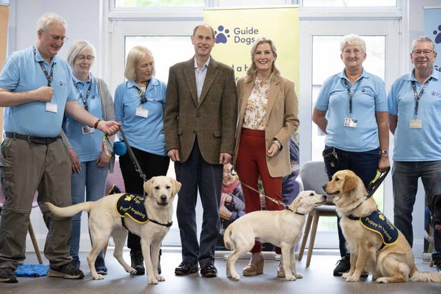 The Duke of Edinburgh and Duchess of Edinburgh, along with a four-month-old puppy named Lucy, take part in a puppy class at the Guide Dogs for the Blind Association Training Centre in Reading