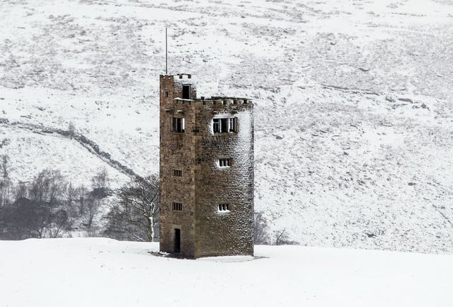 Snow surrounds Boots Folly in the Peak District