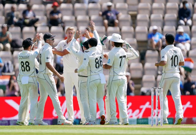 New Zealand’s Kyle Jamieson (centre) celebrates taking the wicket of India’s Virat Kohli 