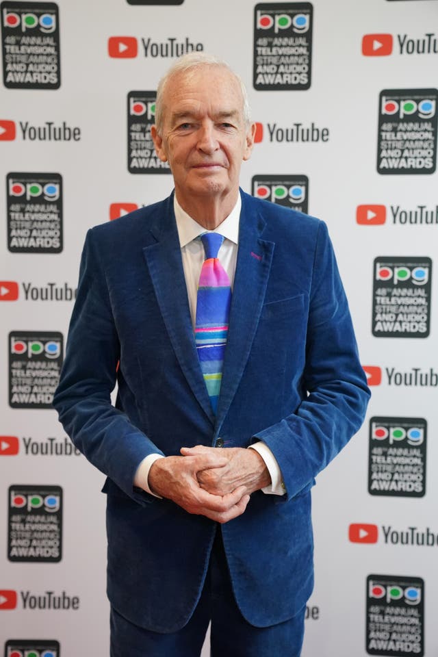 Jon Snow poses for photographers at the Broadcasting Press Guild Awards in London