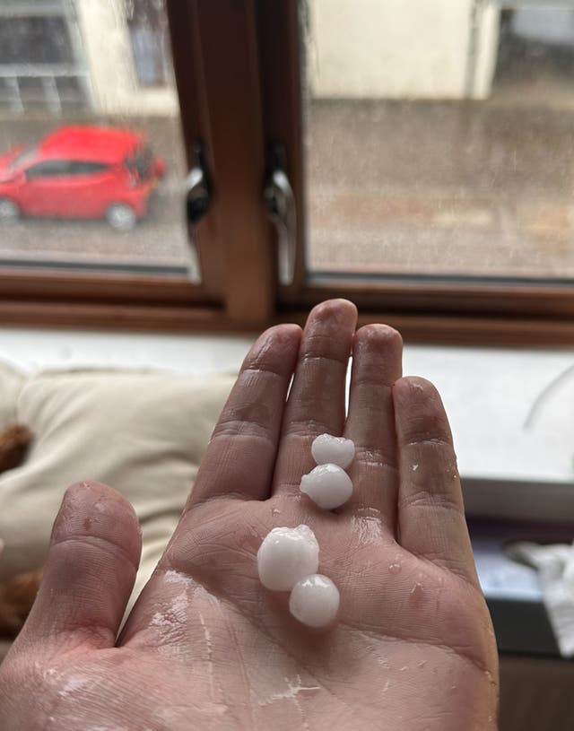 Man holding hail stones