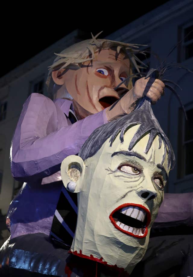 An effigy of Boris Johnson with Theresa May's head