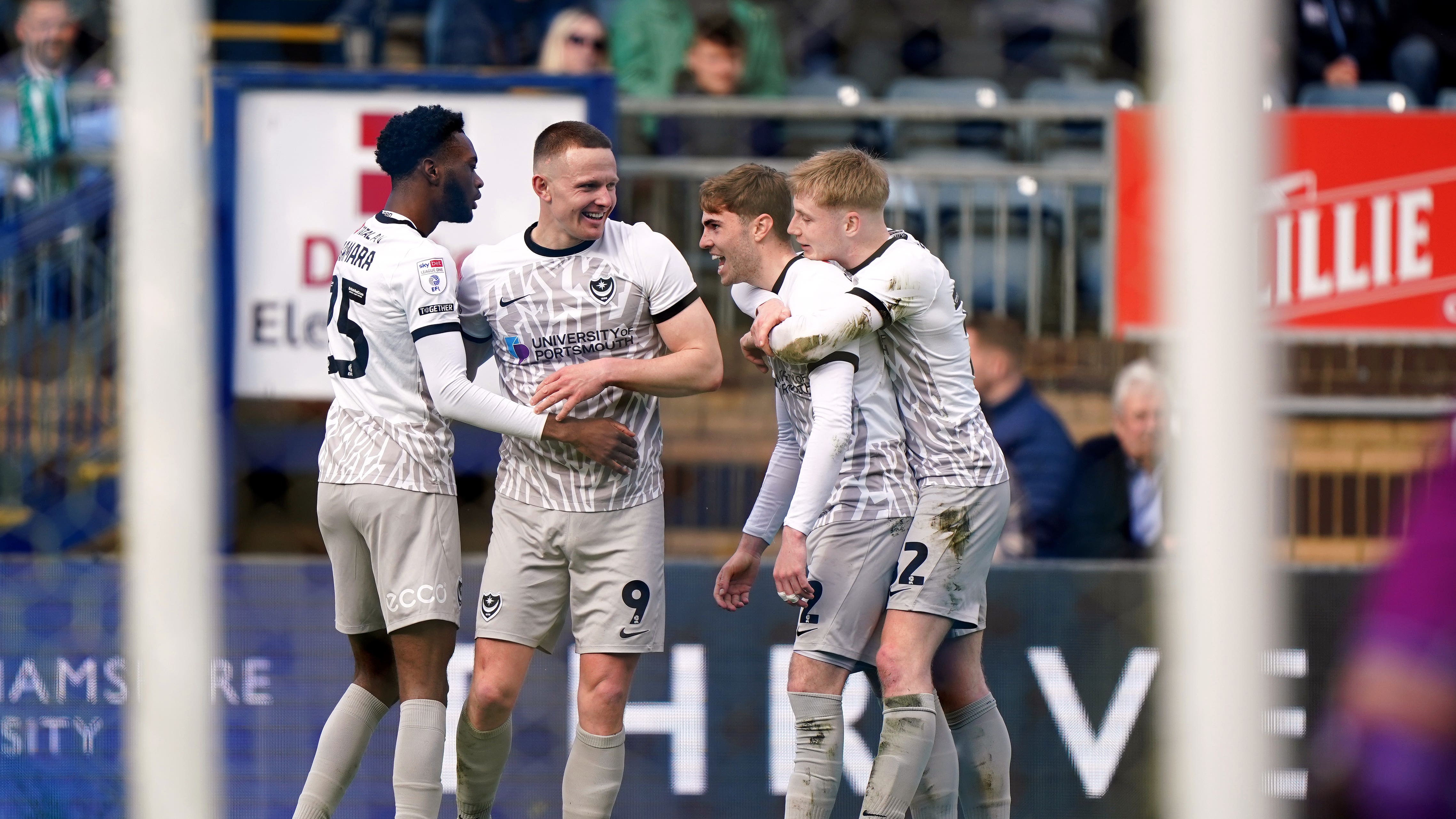 Portsmouth’s Colby Bishop (centre left) celebrates scoring his second of the afternoon (Bradley Collyer/PA)