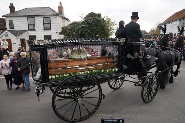 The funeral cortege of Paul O’Grady travels through the village of Aldington, Kent