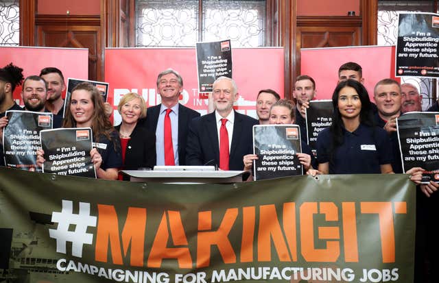 Mr Corbyn and Mr Leonard with apprentices and engineers at the Fairfield Ship Building Museum in Glasgow (Jane Barlow/PA)