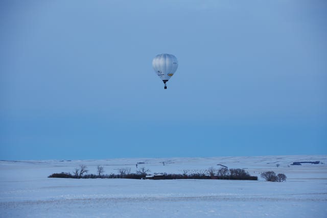 The hot air balloon during the feat (Johnny Green/PA)