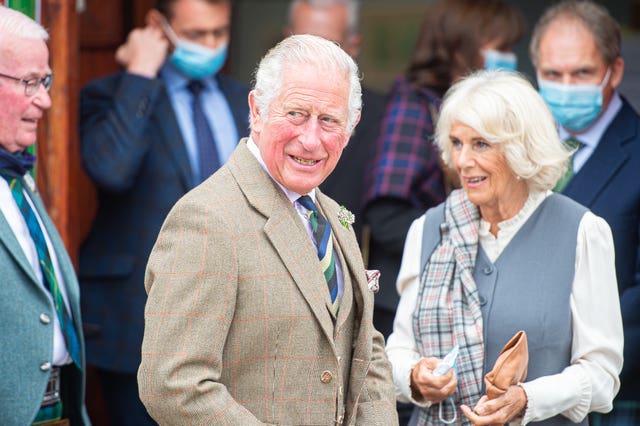 Prince of Wales and the Duchess of Cornwall, known as the Duke and Duchess of Rothesay when in Scotland, on a walk through the village during a visit to the Ballater Community & Heritage Hub in Ballater, Aberdeenshire (Wullie Marr/DCT Media/PA)