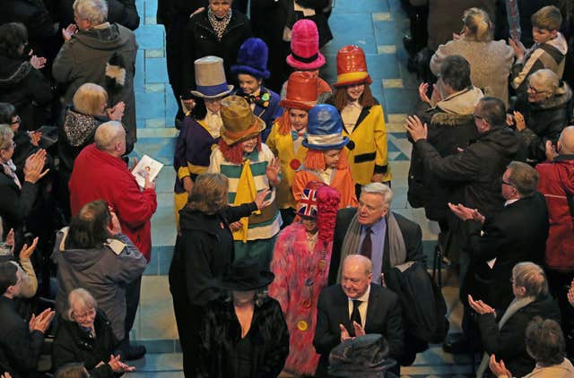 Children dressed as Diddymen follow Sir Ken Dodd’s coffin (Aaron Chown/PA)