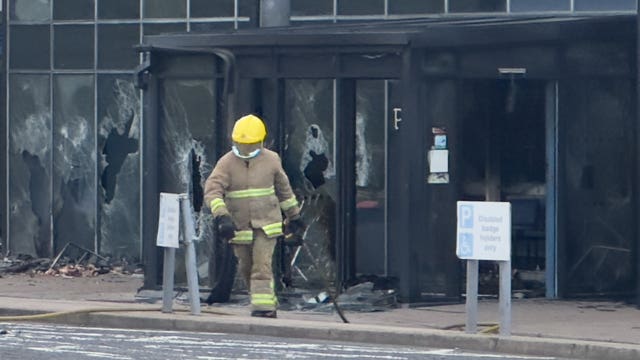 A firefighter outside Larne Leisure Centre following vandalism