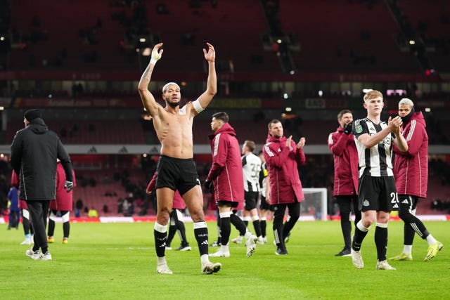 Newcastle players celebrate their win at the Emirates 