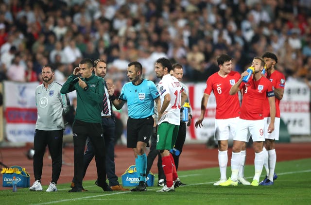Referee Ivan Bebek, centre, speaks to England manager Gareth Southgate during a stoppage in the Euro 2020 qualifier in Bulgaria