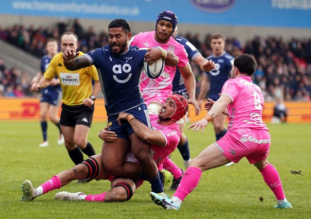 Sale's Manu Tuilagi is tackled by Stade Francais’ Mathieu Hirigoyen during their Champions Cup match 