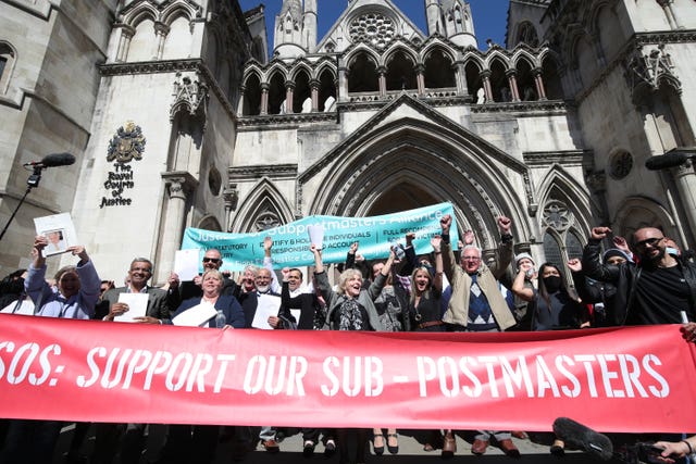 Former post office workers celebrate outside the Royal Courts of Justice, London, after having their convictions overturned by the Court of Appeal