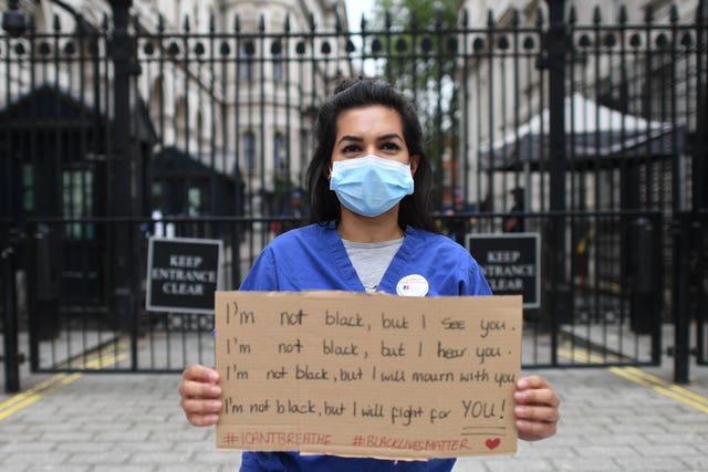 Nurse Ameera Sheikh protests outside Downing Street, London, demanding a pay rise, real protection against COVID-19 and and the release of Public Health England’s review into BAME NHS staff’s deaths (Stefan Rousseau/PA)