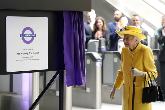 The Queen unveils a plaque to mark the Elizabeth line&rsquo;s official opening at Paddington station in London