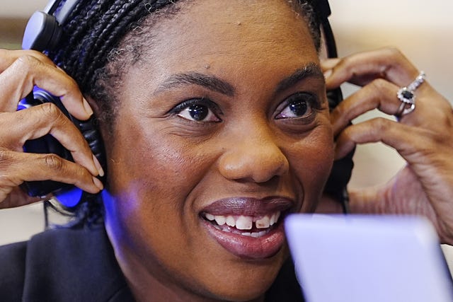 Kemi Badenoch in headphones