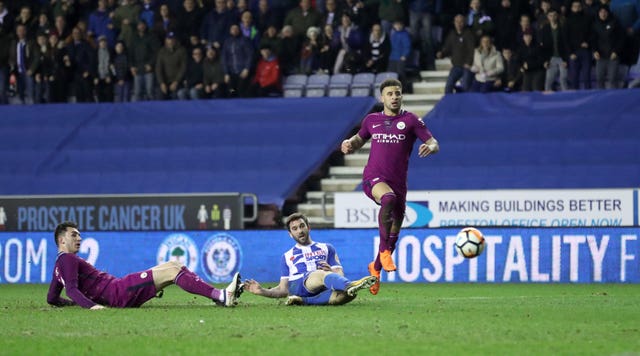 Manchester City's quadruple hopes were ended last season by an FA Cup defeat to Wigan (Martin Rickett/PA).