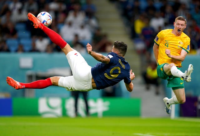 Olivier Giroud, left, attempts an overhead kick against Australia