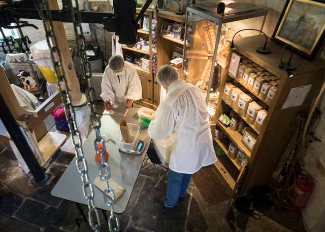 Flour is placed into bags inside the windmill