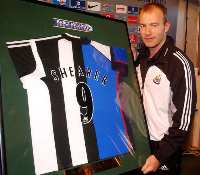 Alan Shearer is presented with a Newcastle-Blackburn half and half shirt after scoring 100 Premier League goals for each club