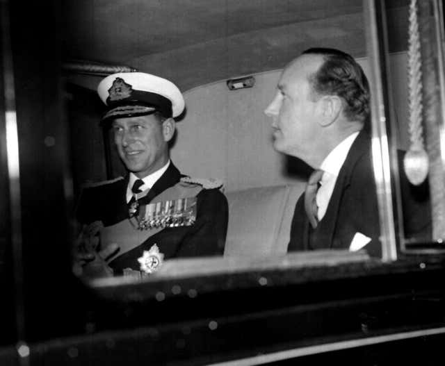 Philip with his former private secretary Lieutenant-Commander Mike Parker, who insisted the duke was 100% faithful to the Queen