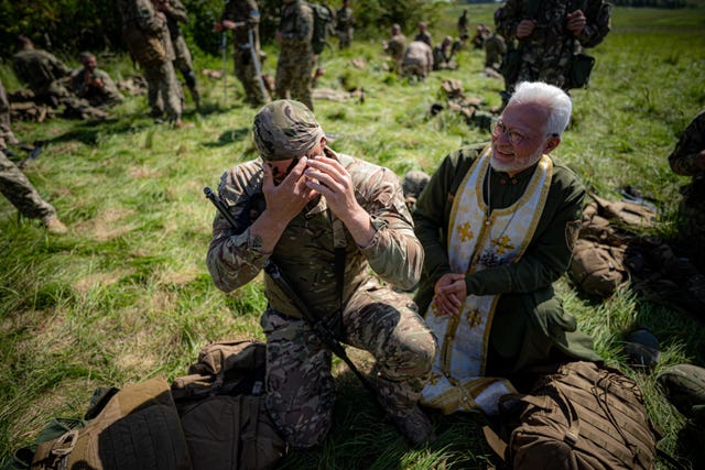 Ukrainian military chaplains have completed their training alongside Ukrainian soldiers and British Army training staff (Ben Birchall/PA)